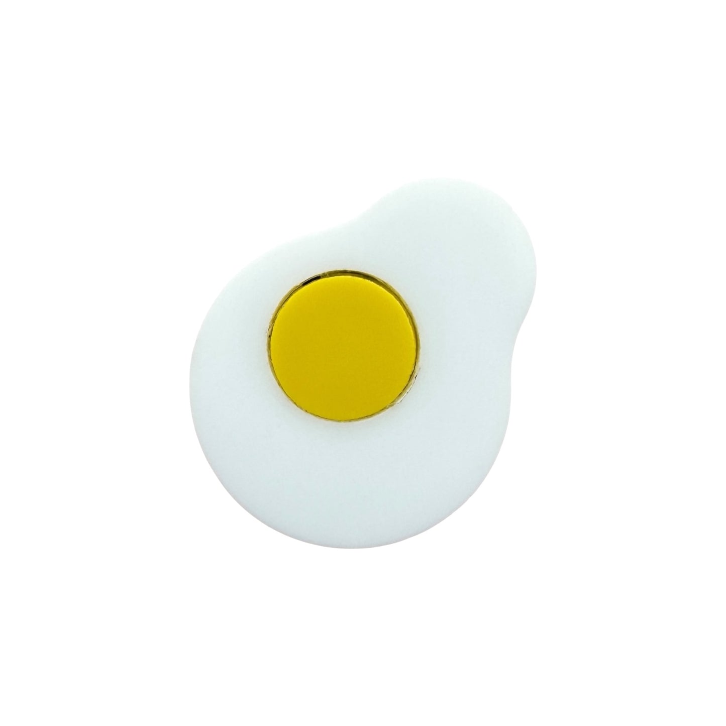 Fried egg pin. White with yellow center on a white background