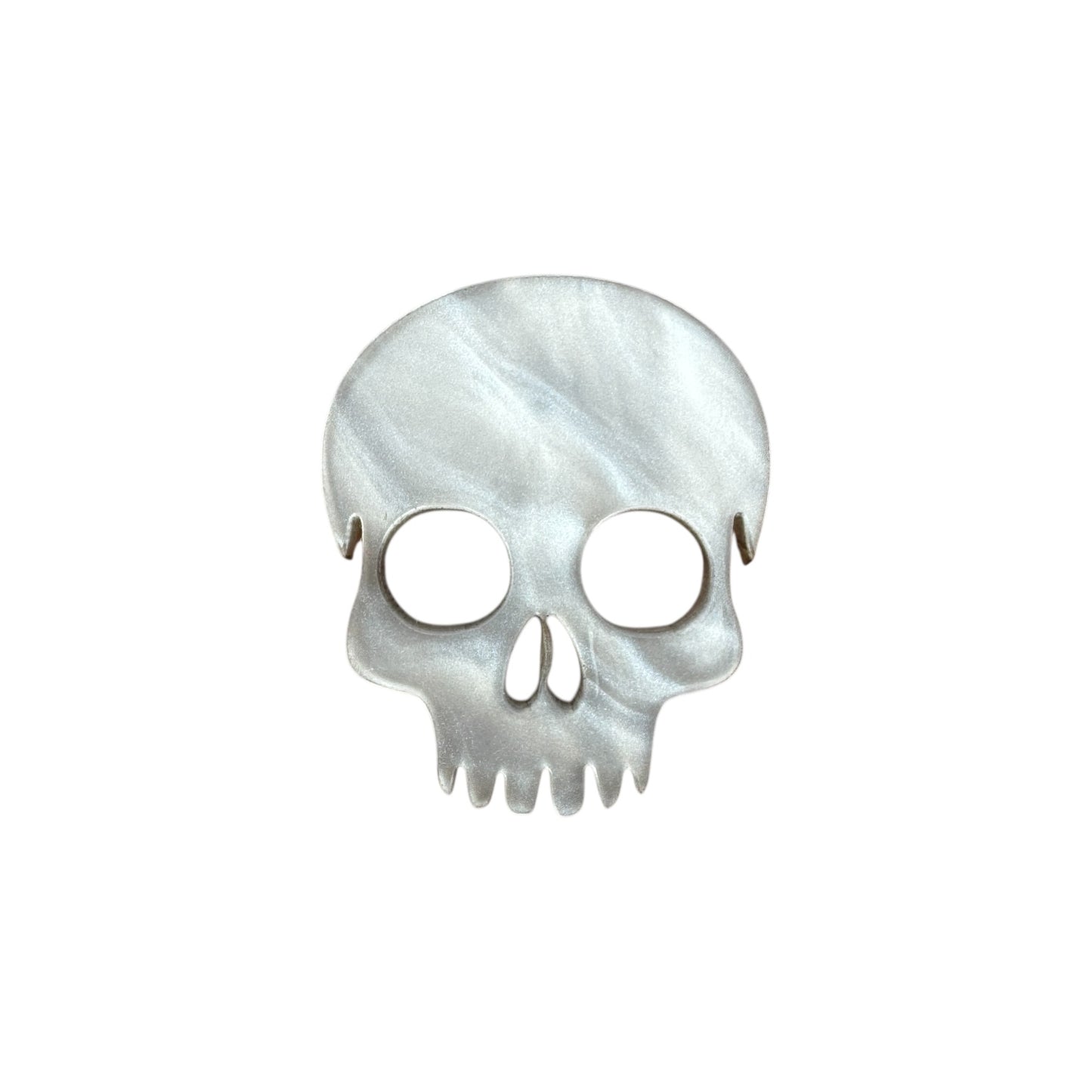 White Skull-shaped pin on a white background