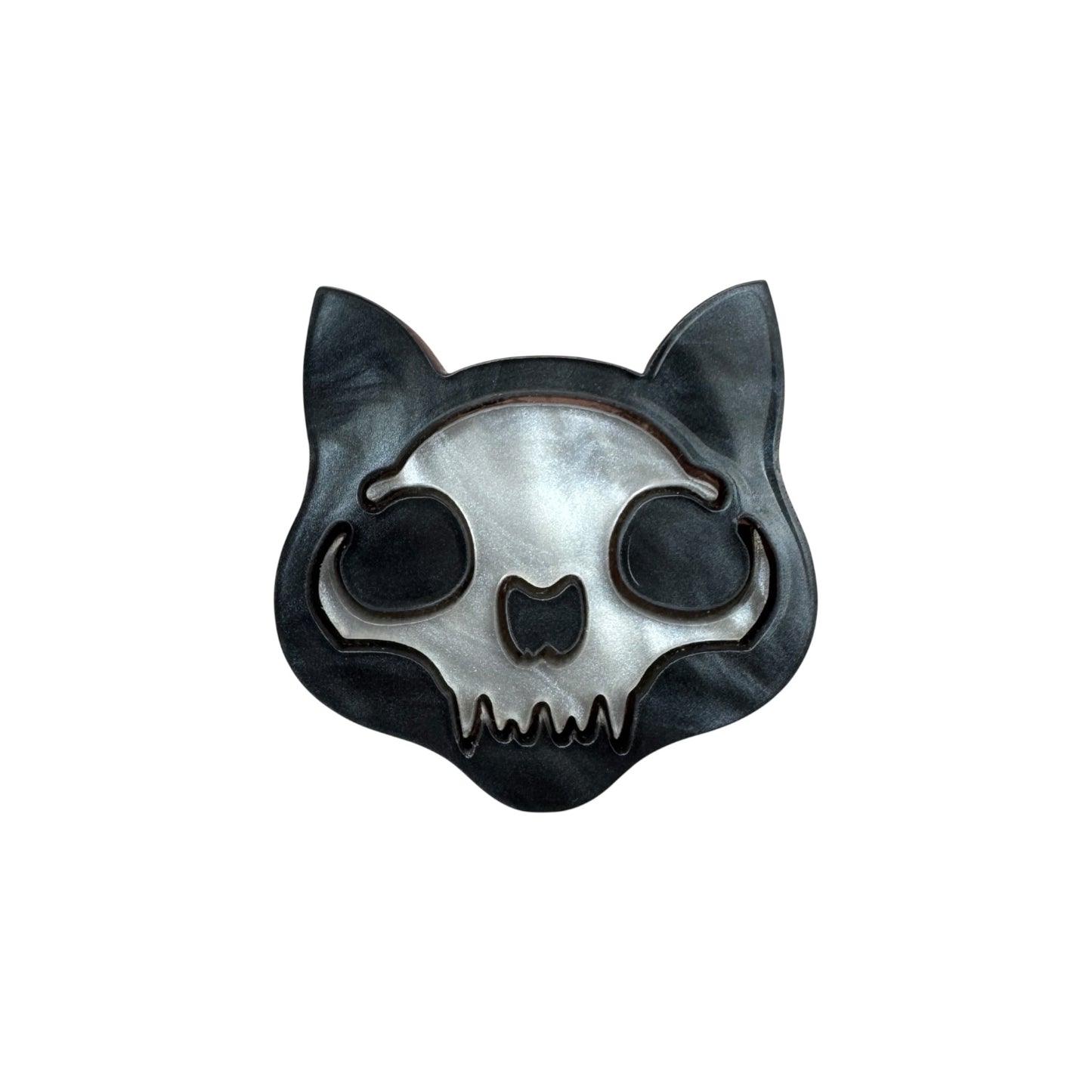 X-ray cat-shaped skeleton pin on a white background