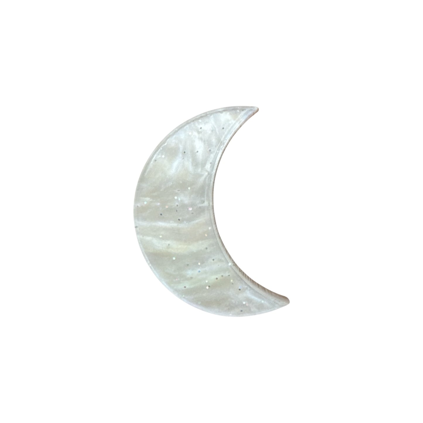 Crescent moon-shaped pin on a white background