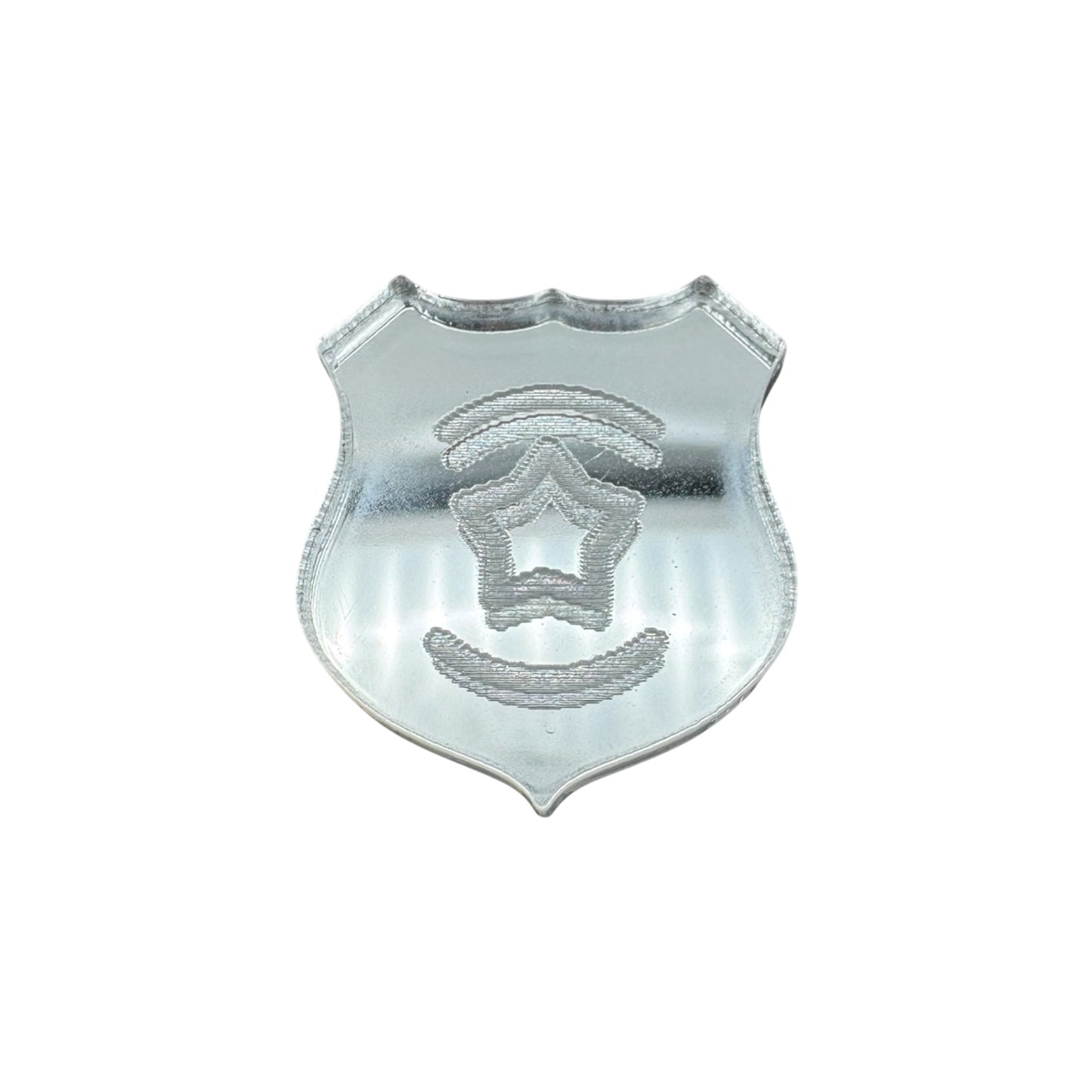 Pin of a metallic police badge with star emblem on a white background