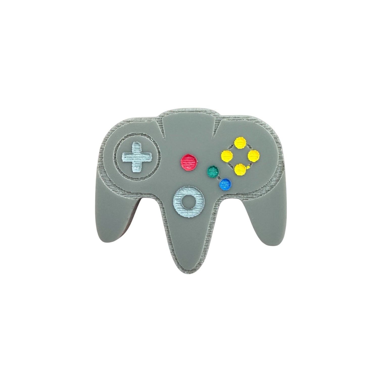 Gray gaming controller-shaped pin on a white background