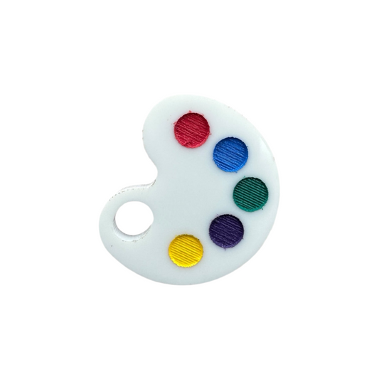 Small round painter's palette with red, blue, green, purple, and yellow colors on a white background