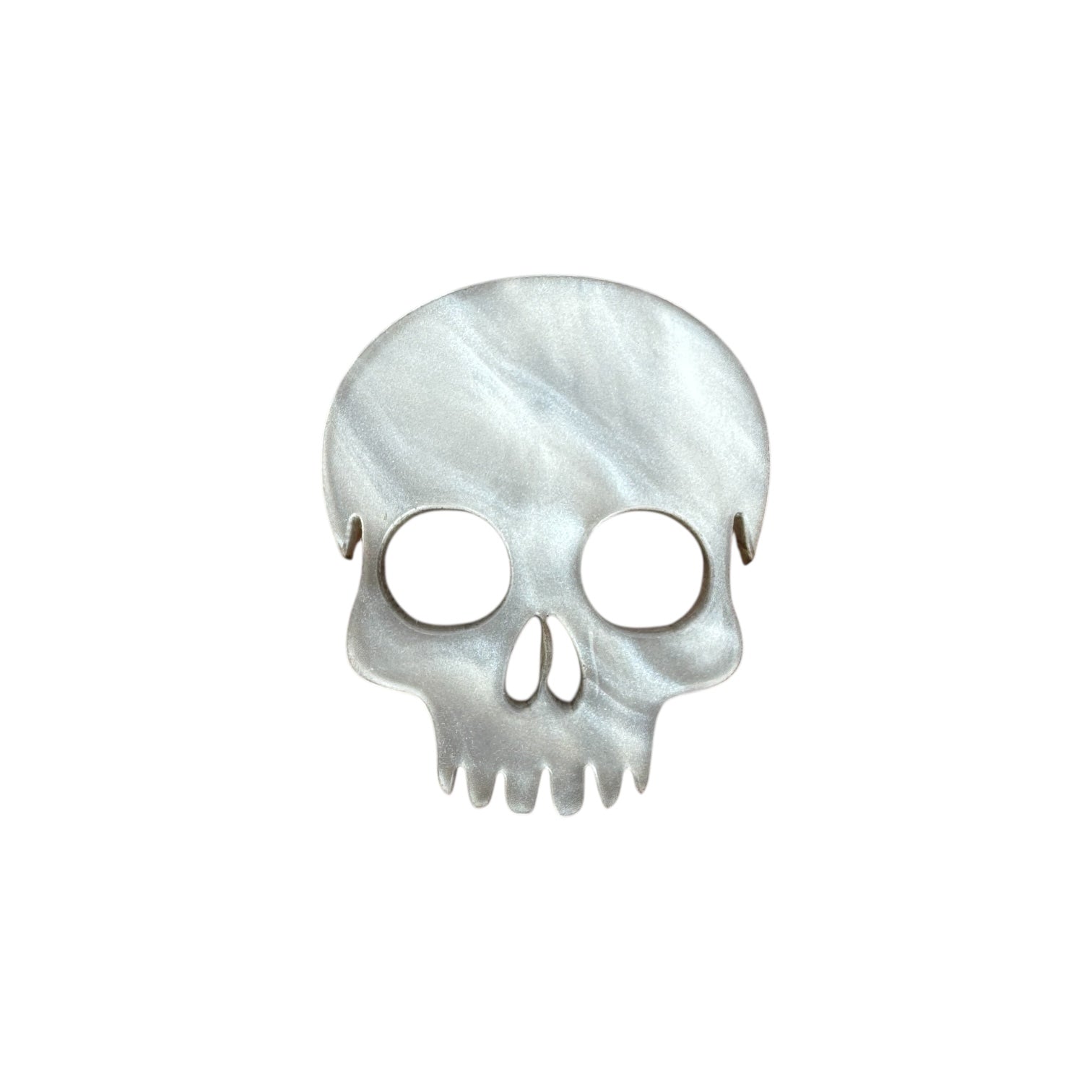 White Skull-shaped pin on a white background

