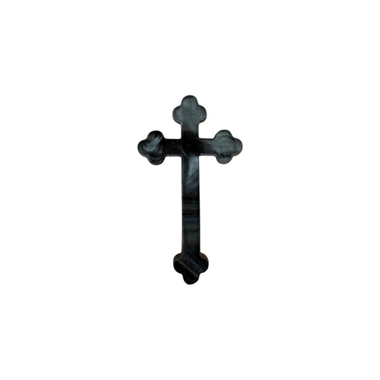Black gothic cross designed pin on a white background

