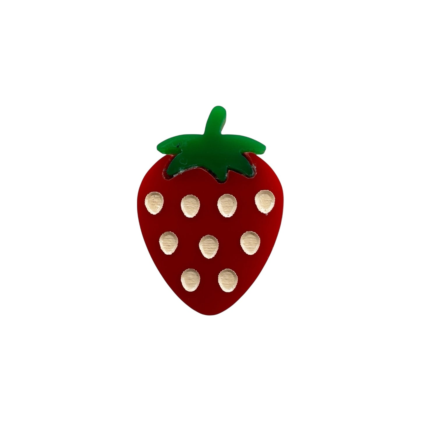 red strawberry pin with green leaves on a white background