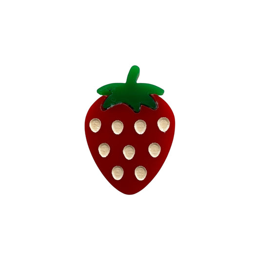 red strawberry pin with green leaves on a white background