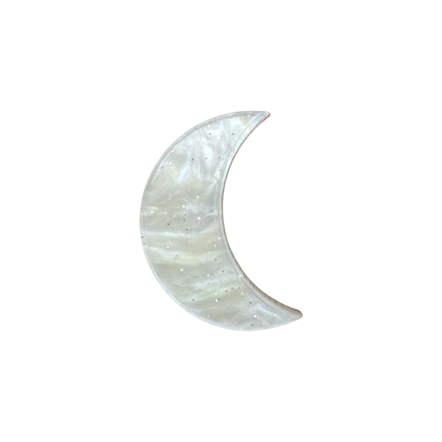 Crescent moon-shaped pin on a white background